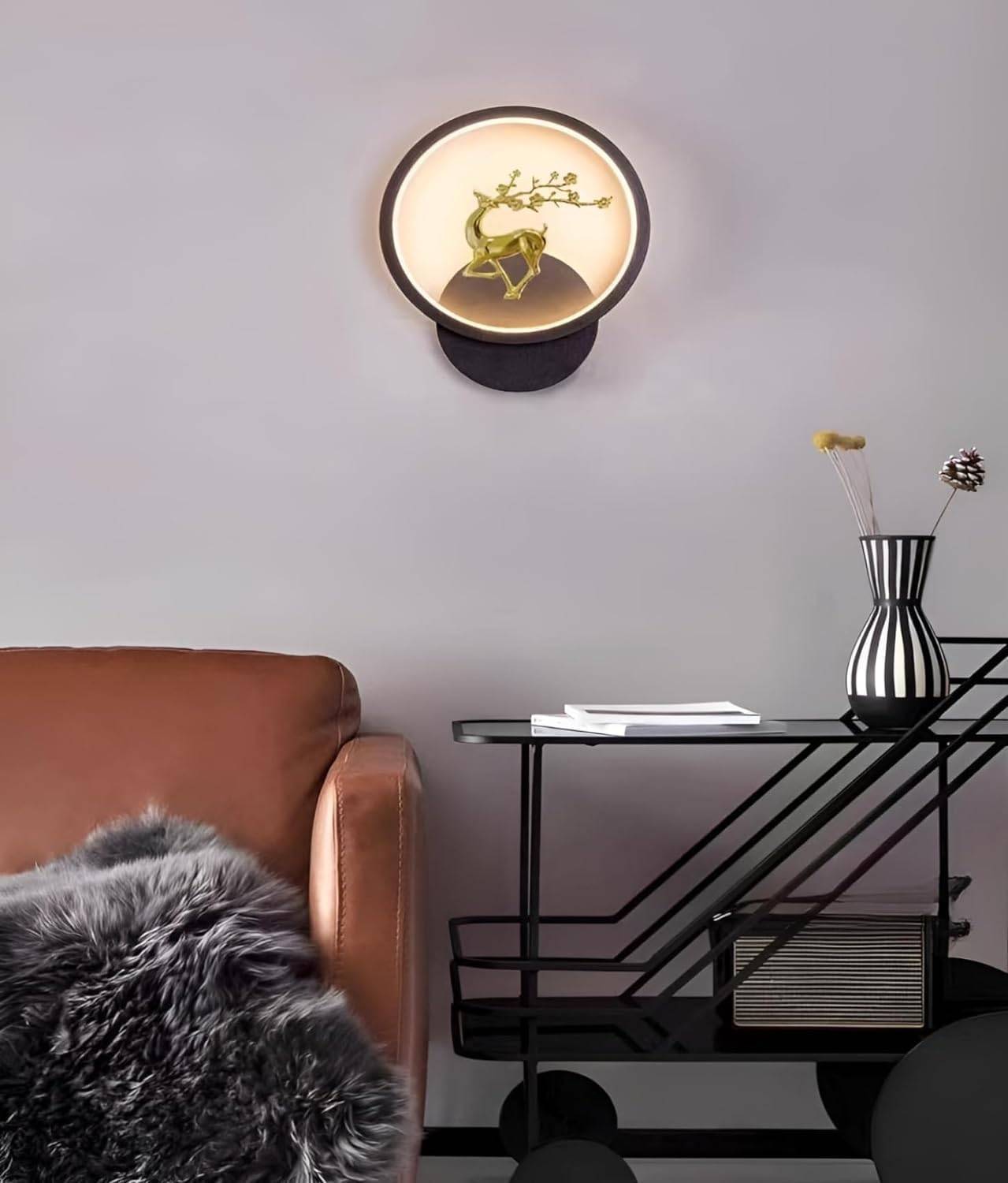 Round LED 3-color decorative wall light mounted in modern bedroom interior